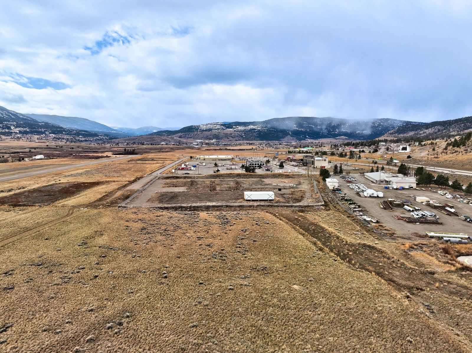 Aerial view over the Airport Road lands in Merritt, with the Nicola Valley hills behind